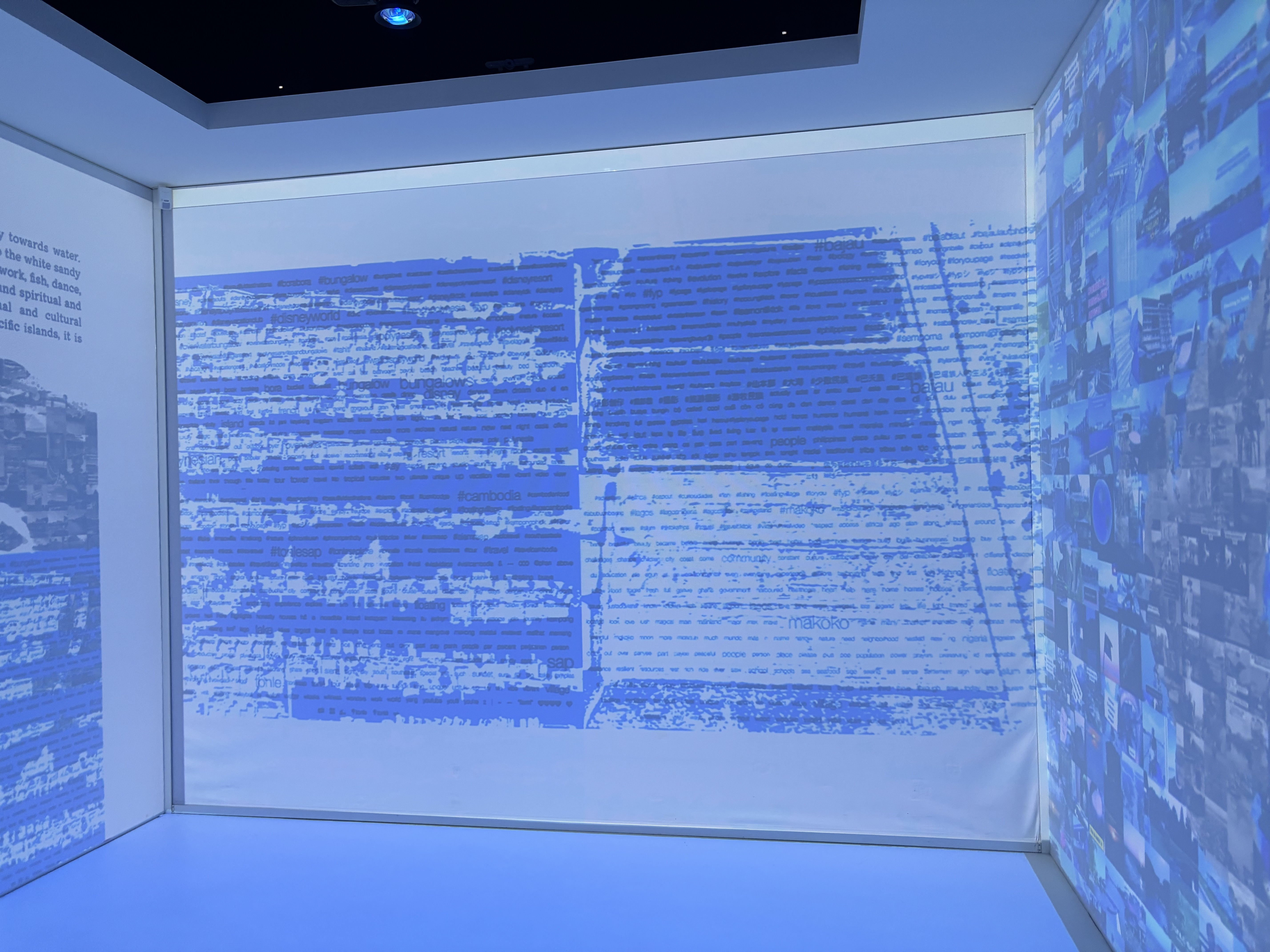 A picture of a wall in the room with on the wall a projection